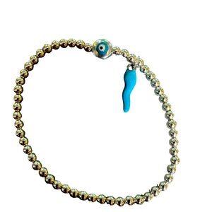 Silver Hematite stretch with blue charm and little evil eye